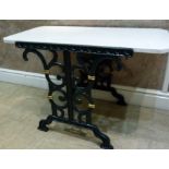 A reproduction cast metal garden table, the canted rectangular top supported on a pair of foliate