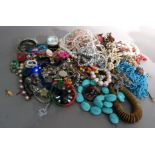 A quantity of costume jewellery including necklaces, rings, bangles, brooches, etc