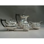 A four piece silver tea service, Sheffield 1945 of oblong outline with gadroon rim and on bun feet