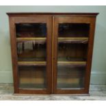 A Victorian walnut glazed wall cabinet enclosed by a pair of glazed doors, 80cm wide x 80cm high