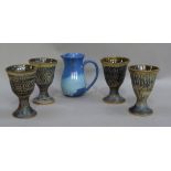 A set of four studio pottery goblets, initialled MS and an American studio pottery jug of blue glaze
