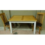 An oak topped extending kitchen table on pale grey painted base, together with a pair of slat back