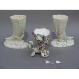 A pair of Royal Worcester shell vases on lock, coral and seaweed bases, 16cm high (one with
