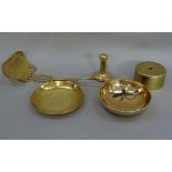 A brass chestnut roaster, a brass bowl from a shell base, two other brass bowls, and a brass tamper