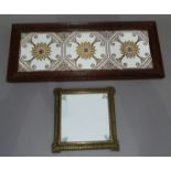 A set of three Mintons tiles in brown and gilt stylised flower design presented in an oak frame,