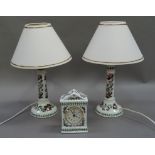 A pair of Portmeirion Botanic Garden lamps and a mantel clock