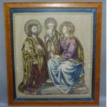 An embroidered panel of Mary, Joseph and Christ, applique against ribbed silk ground within a blue