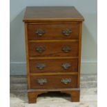A mahogany chest in George III style, the top boxwood strung to the edge above four long drawers,