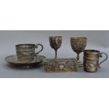 Two small wine goblets, a small cup, a trinket box and a cup and saucer, not matching, in white