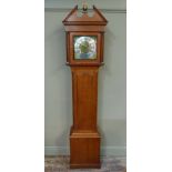 A George III oak cottage longcase clock with architectural pediment centered on a ball and eagle