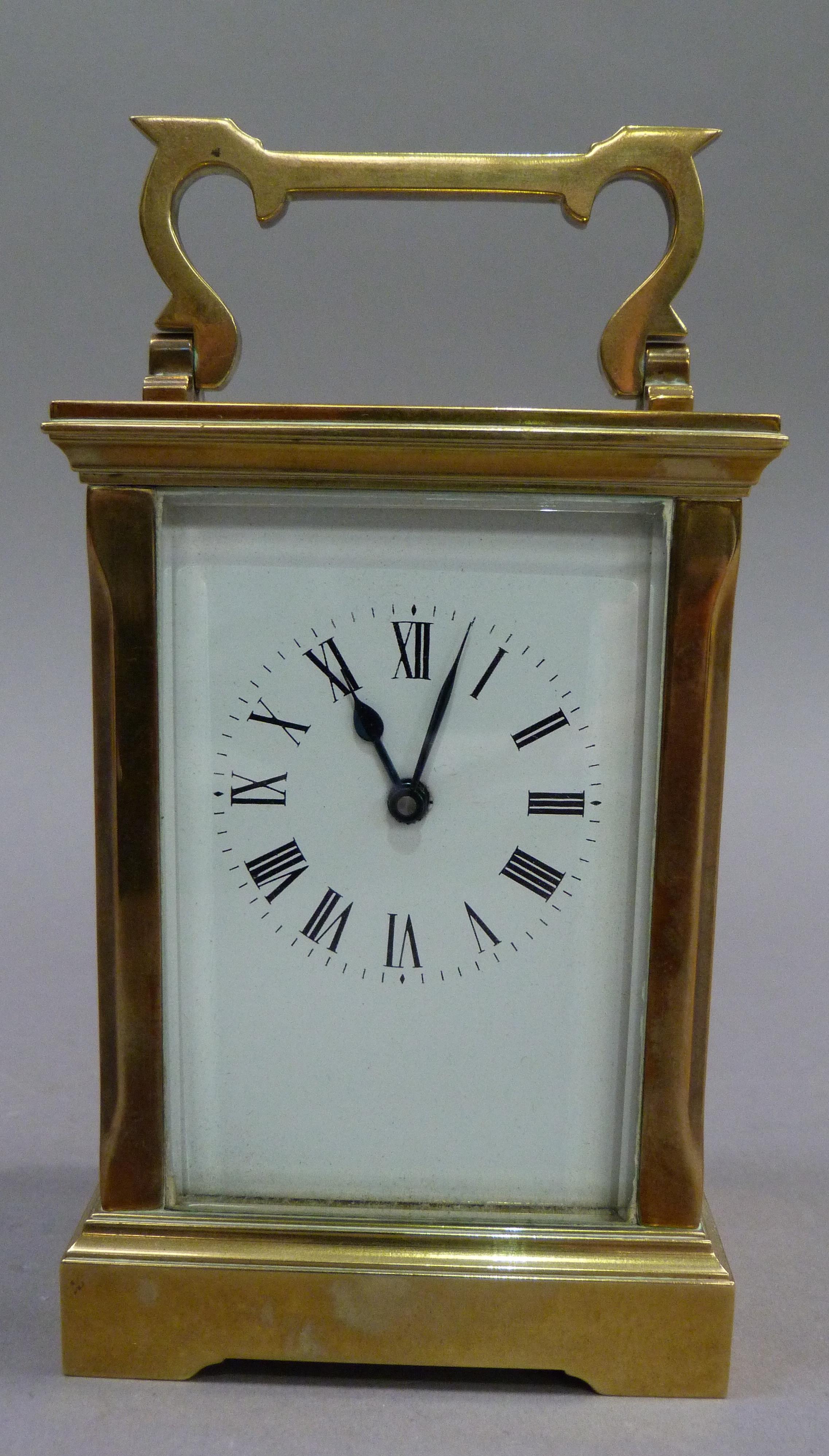 A brass carriage clock the white enamelled dial having black Roman numerals complete with key, 15. - Image 2 of 3