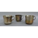 A pair of white metal cups and one other, possible Indian of plain form, tests as silver, 14oz