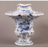 A 19the century Dutch delft blue and white vase of urn shape with square shoulder, painted with a