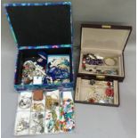 Two jewellery boxes each containing a quantity of costume jewellery including rings, necklaces,