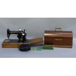 A Singer sewing machine with electric motor and light, No ED767304, with case