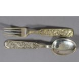 DAVID ANDERSEN, Norway, a child's .830 sterling silver spoon and fork set, each handle decorated