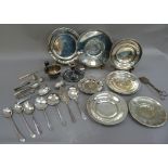 A quantity of silver plated ware including four plates in two sizes with beaded rims, another with
