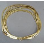 A necklace by Christian Dior c.1964 in rolled gold square links of six graduated rows