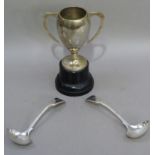 A silver plated two handled trophy cup on black plinth base, together with a pair of silver plated