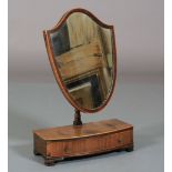 A GEORGE IV ROSEWOOD VENEERED TOILET MIRROR, outlined in boxwood stringing, the shield-shaped