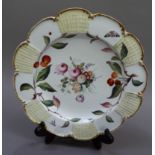 A 19th century porcelain plate, circular scalloped outline, painted to the centre in polychrome