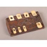 A Japanese copper and ivory whist marker, Meiji period, rectangular, cast with cranes amongst