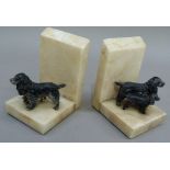 A pair of 1930s alabaster and cold painted gun dog mounted bookends, 12cm high