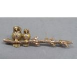 A Victorian rustic bar brooch in 9ct rose and yellow gold, two owls (Victorian symbol of wisdom)