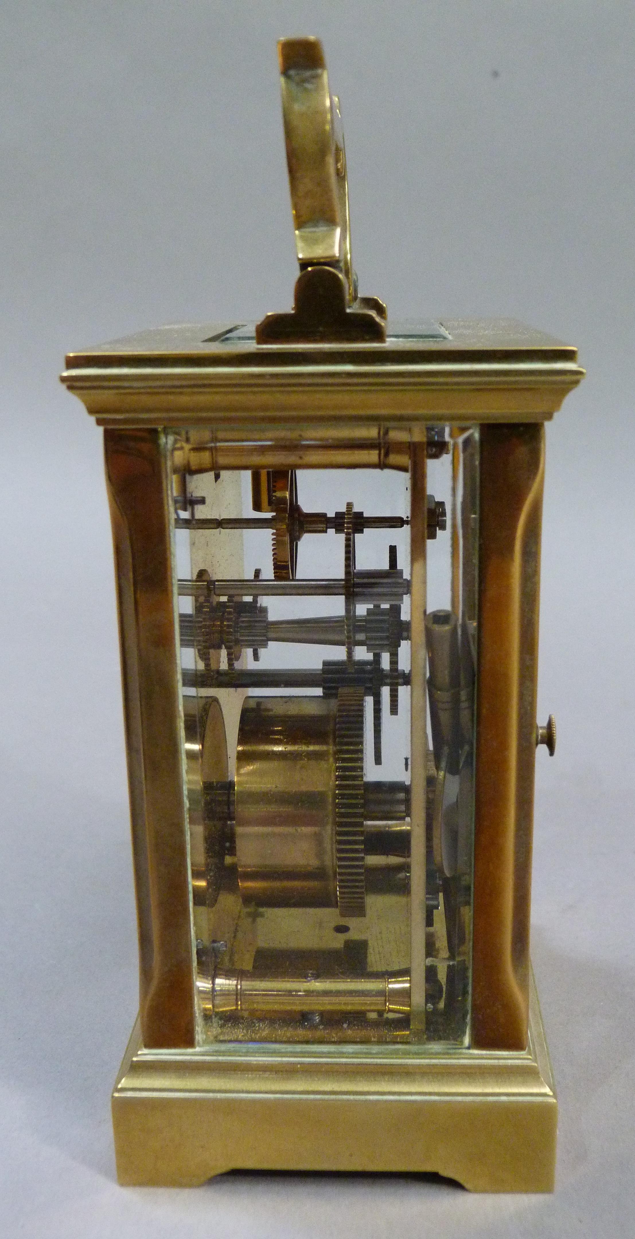 A brass carriage clock the white enamelled dial having black Roman numerals complete with key, 15. - Image 3 of 3