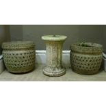 A pair of concrete garden planters of pierced hatched form with guilloche rims together with a