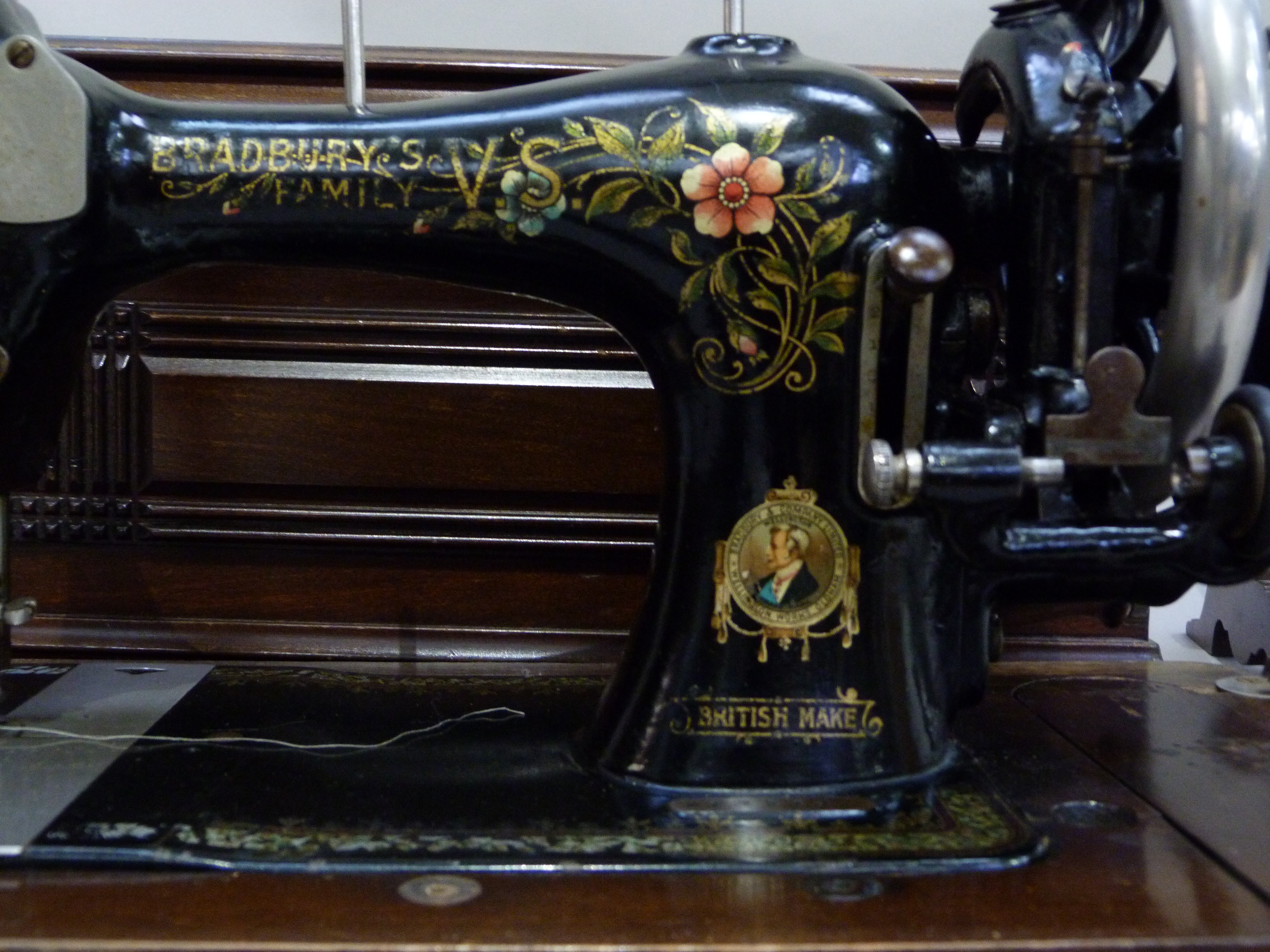 An early 20th century Bradbury's family sewing machine, black enamelled and printed in polychrome - Image 2 of 2