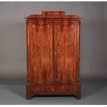 A MID 19TH CENTURY BEIDERMEIER MAHOGANY CUPBOARD, the stepped pediment fitted with a small drawer,