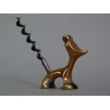 An English plated on copper corkscrew in the form of a dog, the plate now worn, 6.5cm high