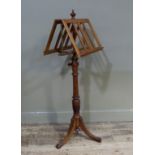 A late Victorian mahogany duet stand of conventional form with urn finial, fluted and spiral