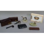 A black leather cigar case, a brown leather case, two Dunhill pipes in original packaging, an onyx