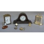 An early 20th century mantel clock of swept arched outline with pierced bronzed metal case on