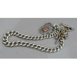 An Edward VII silver albert chain in graduated curb links with T Bar, swivel fastener and hung