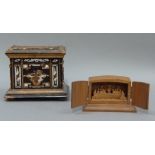A wooden money box decorated overall with silvered fret cut decoration and bone circular boss,
