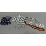 A quantity of costume jewellery including twelve necklaces of uniformed silver or blue beads,