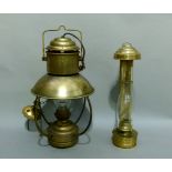 A brass hanging Tilley style lamp together with a wall hanging brass lamp with glass chimney (2)