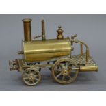 A brass model of a steam engine 19cm wide x 14cm high