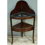 A George III mahogany corner wash stand with shaped upstand, the upper tier with provision for one
