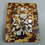 A Victorian tortoiseshell and mother of pearl card case, the foliate inlay within a rectangular