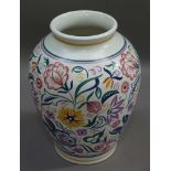 A large Poole pottery vase painted by K Hickisson in typical flower style, 34cm high