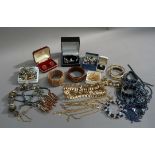 A quantity of costume jewellery including, bracelets, necklaces, chains, glass beads, bangles,