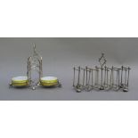 An EPNS 7 bar concertina toast rack on bun feet together with an EPNS toast rack with integral