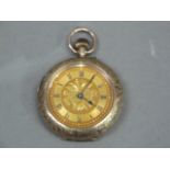 An Edward VII lady's fob watch in 9ct rose gold, open faced case No 29748, gilt engraved and