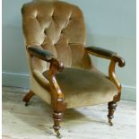 A Victorian walnut button back chair with stuffed overseat arm pads and buttoned back on scrolling
