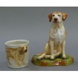 A china figure of a labrador by Royale Stratford together with a golden retriever mug the handle