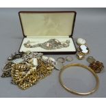 A small collection of costume jewellery including necklaces, brooches, rings and bracelets